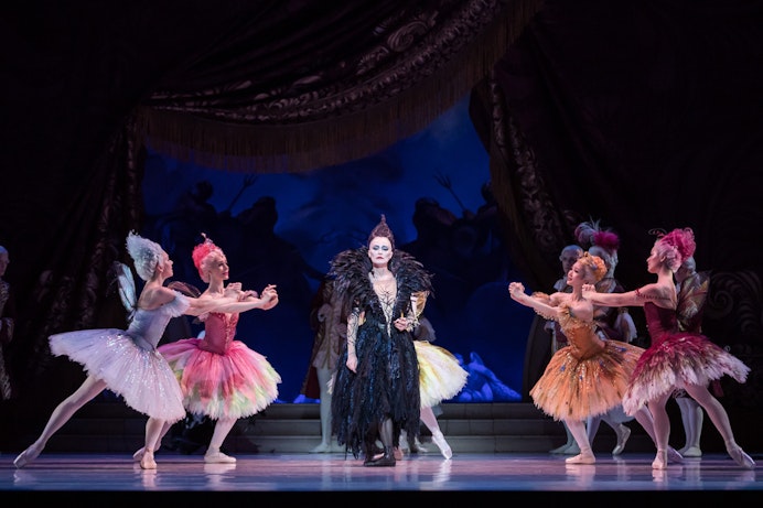 Gillian Revie as Carabosse confronts fairies in "The Sleeping Beauty" ballet.